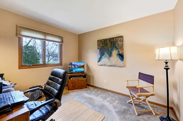 a work room with furniture and a window