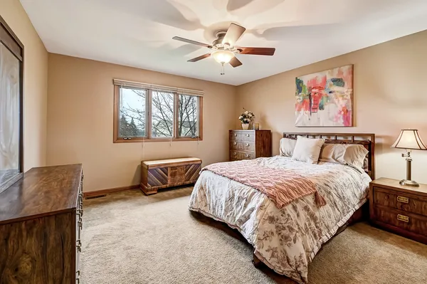 a bedroom with a bed and window