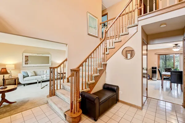 a view of entryway and hall with dining room
