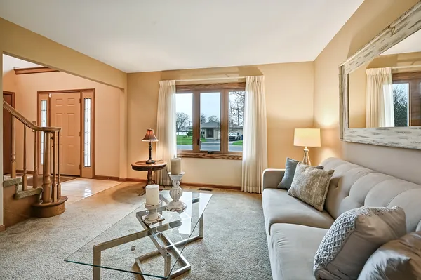 a living room with furniture and a large window
