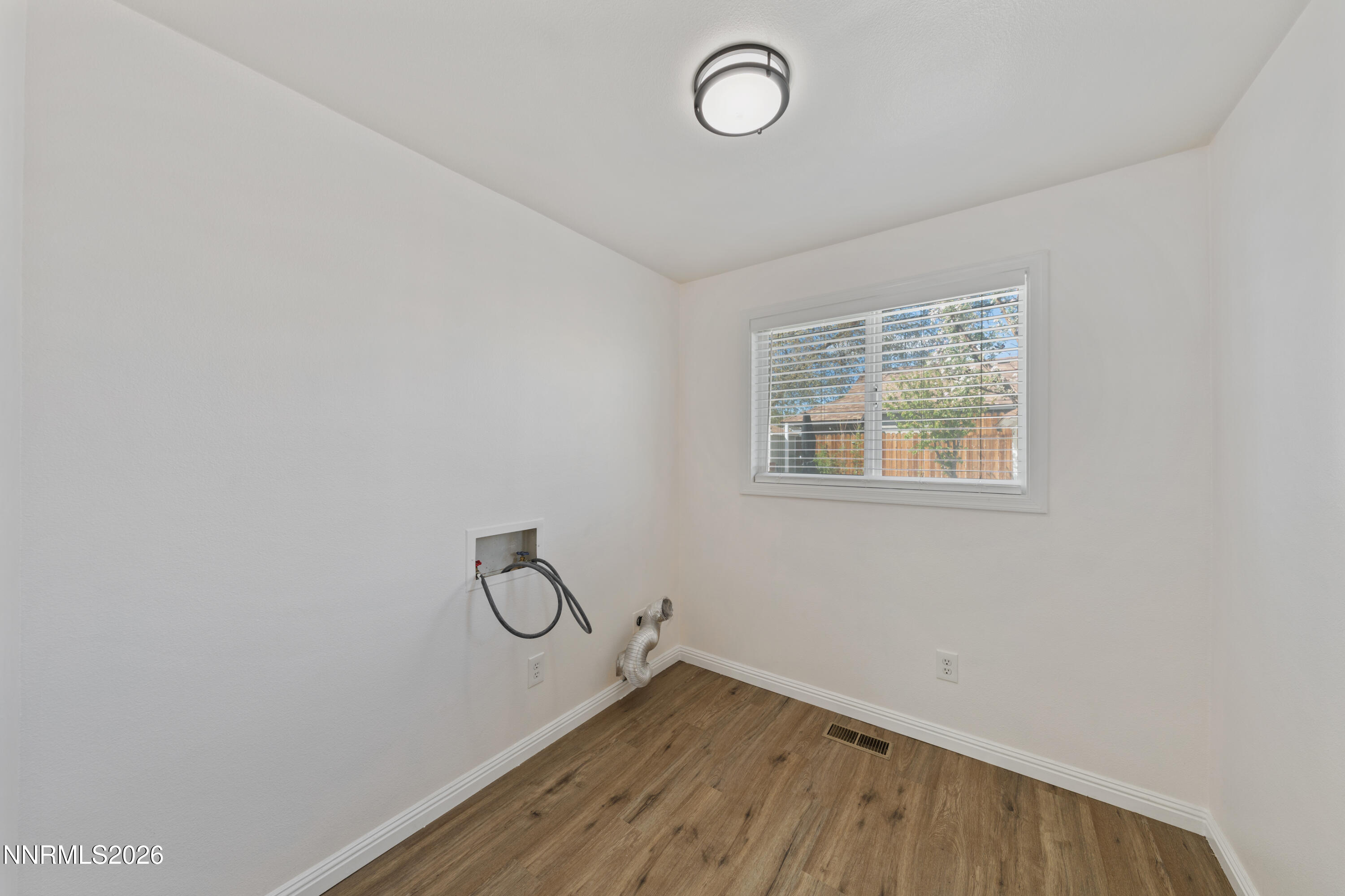 1540 Tyler Way Sparks, NV 89431 - Photo 17 of 30 a view of room with window and wooden floor