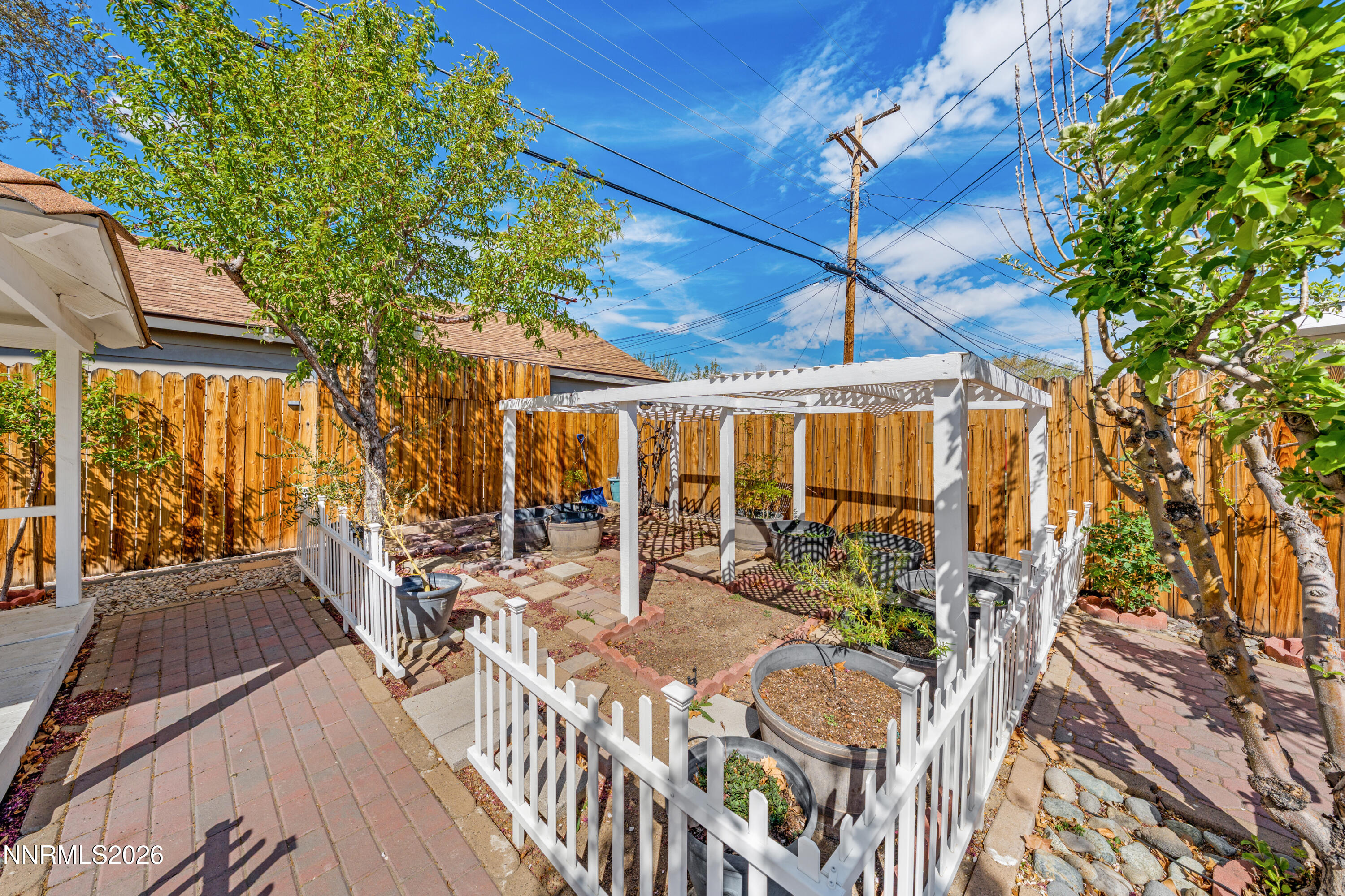 1540 Tyler Way Sparks, NV 89431 - Photo 19 of 30 a view of a patio with table and chairs and potted plants