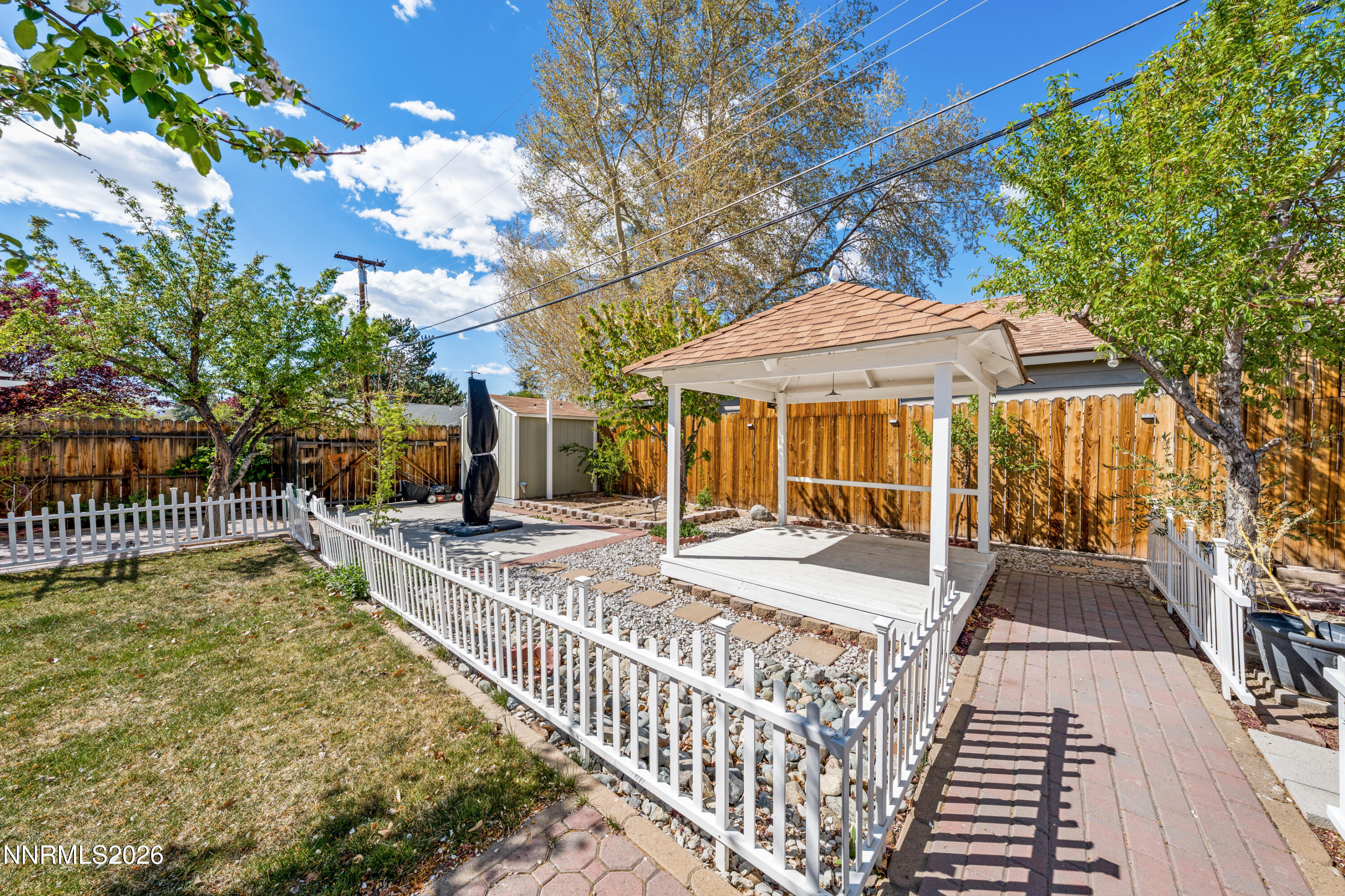 1540 Tyler Way Sparks, NV 89431 - Photo 20 of 30 a view of a house with backyard porch and sitting area