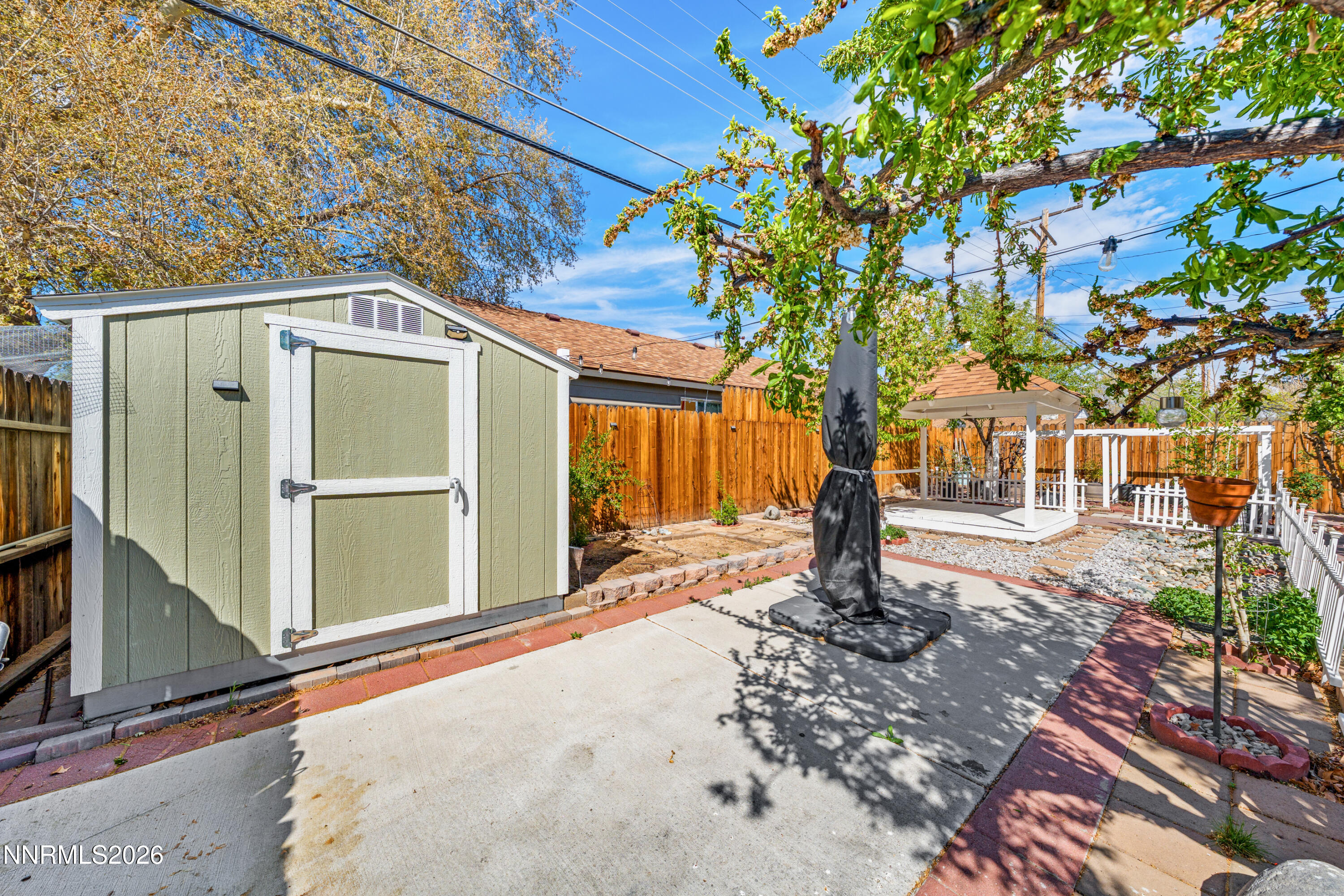 1540 Tyler Way Sparks, NV 89431 - Photo 21 of 30 a house with trees in front of it