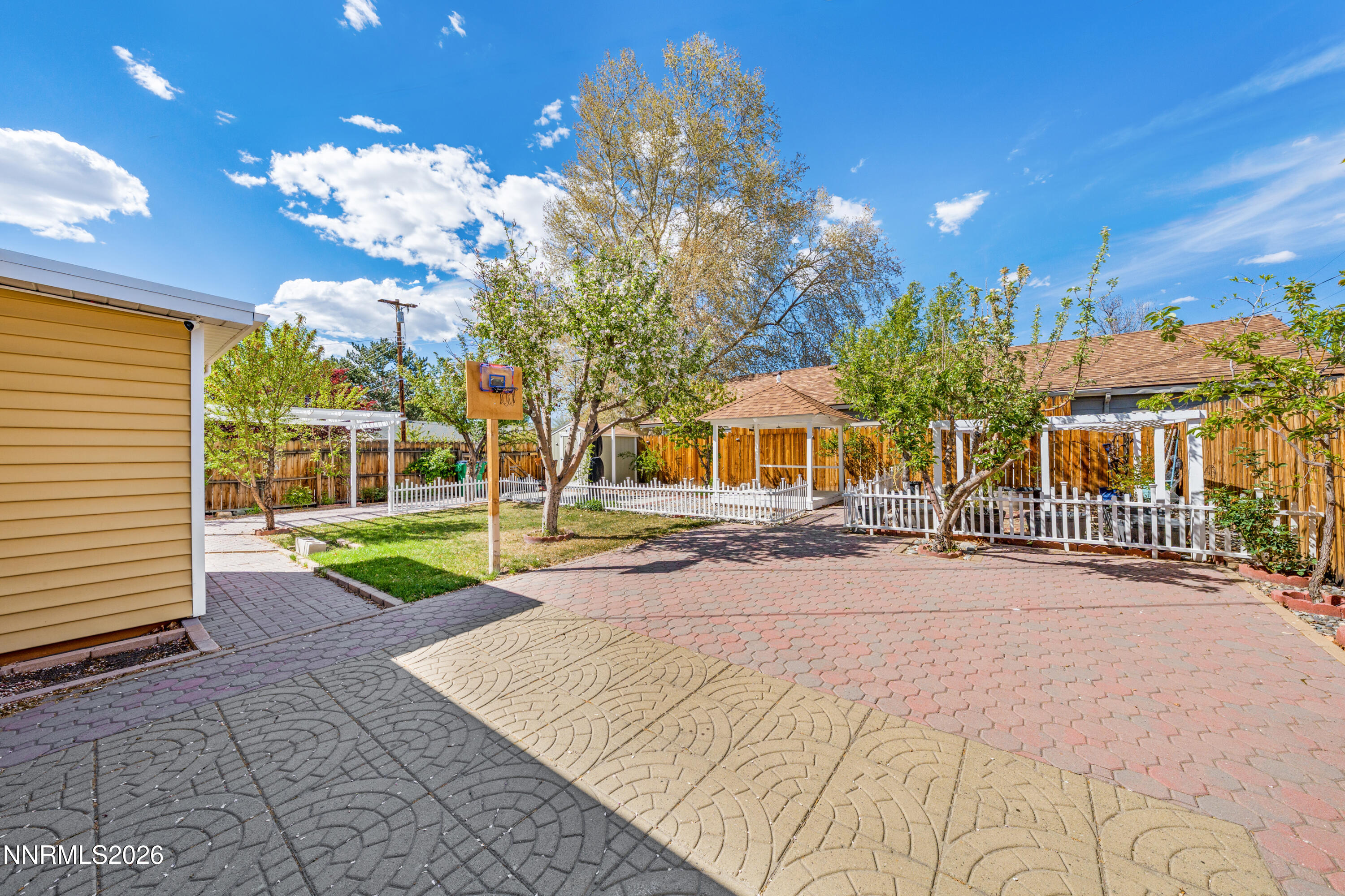 1540 Tyler Way Sparks, NV 89431 - Photo 23 of 30 a view of a house with a yard and potted plants