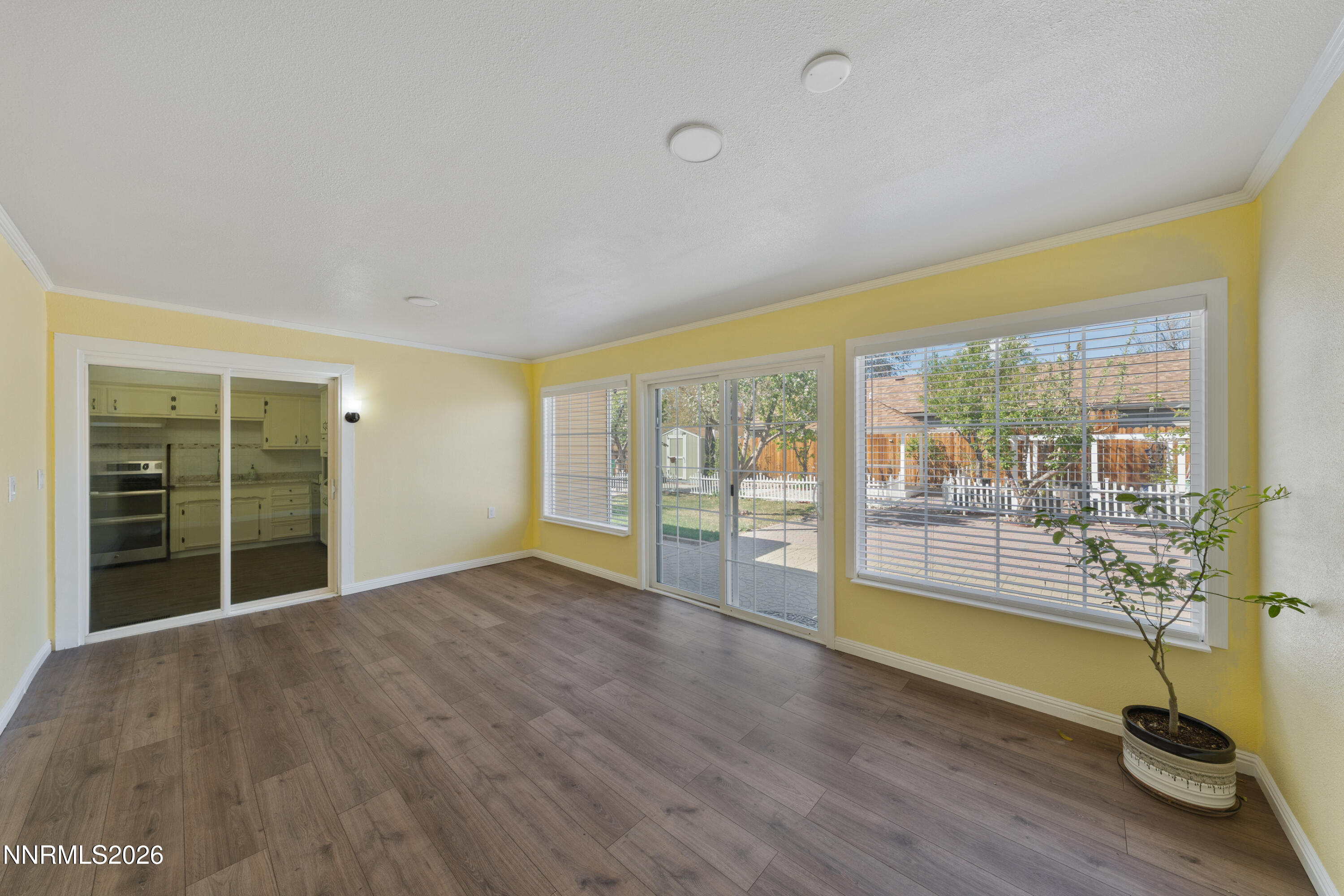 1540 Tyler Way Sparks, NV 89431 - Photo 6 of 30 a view of empty room with wooden floor and fan