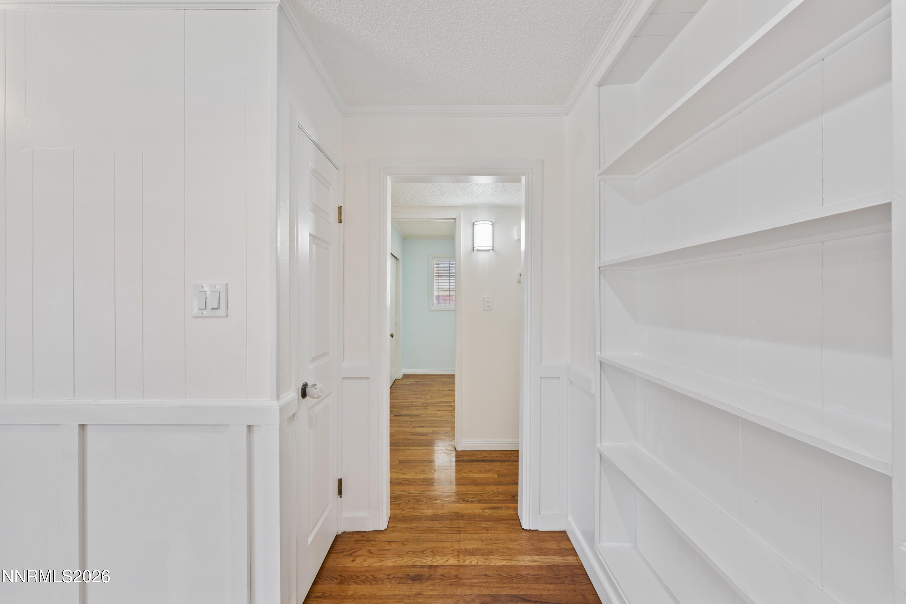 1540 Tyler Way Sparks, NV 89431 - Photo 8 of 30 a view of a hallway with white walls and stairs