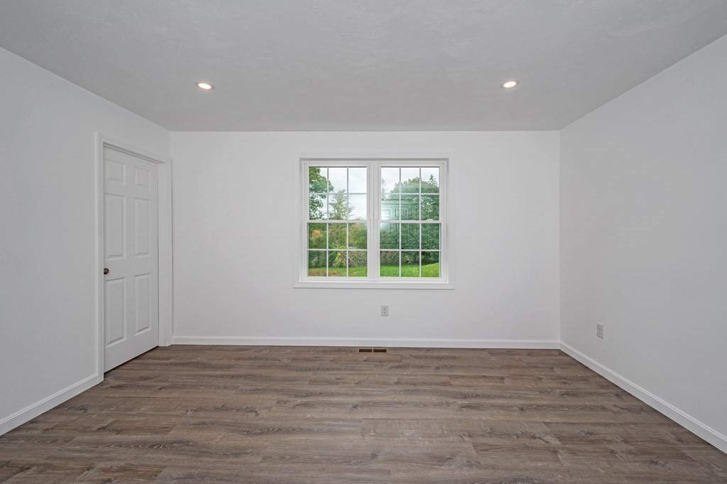 20 May Brook Road Holland, MA 01521 - Photo 14 of 28 a view of an empty room with wooden floor and a window