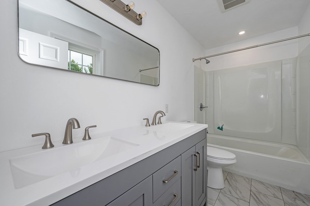 20 May Brook Road Holland, MA 01521 - Photo 15 of 28 a bathroom with a sink mirror toilet and bathtub