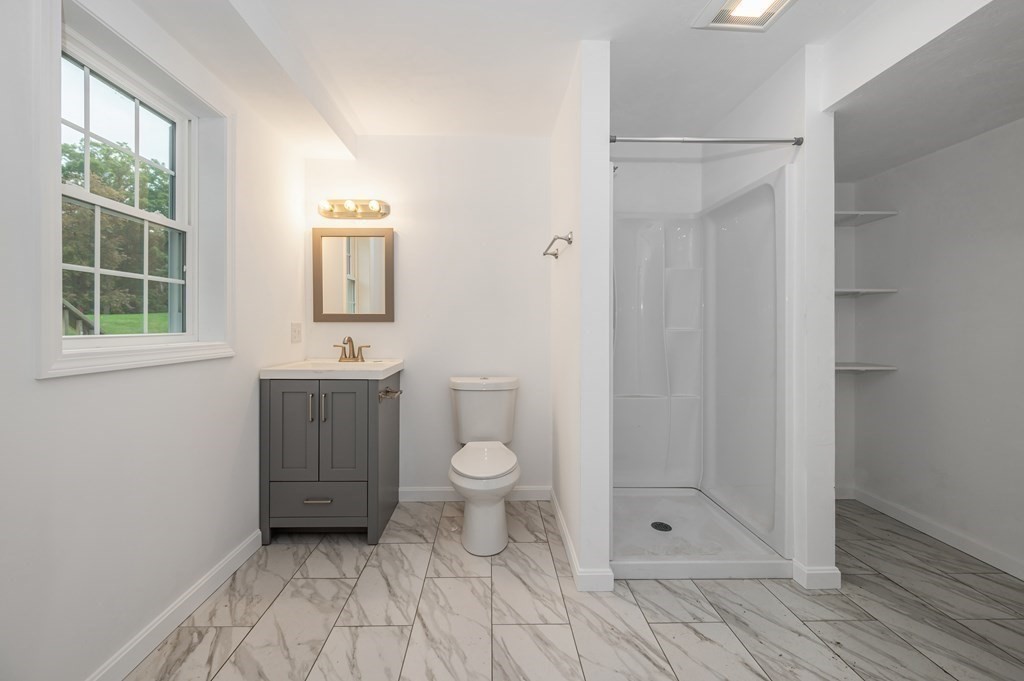 20 May Brook Road Holland, MA 01521 - Photo 24 of 28 a bathroom with a toilet a sink and shower