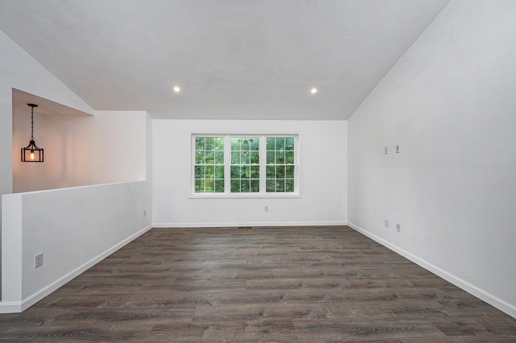 20 May Brook Road Holland, MA 01521 - Photo 3 of 28 a view of an empty room with wooden floor and a window