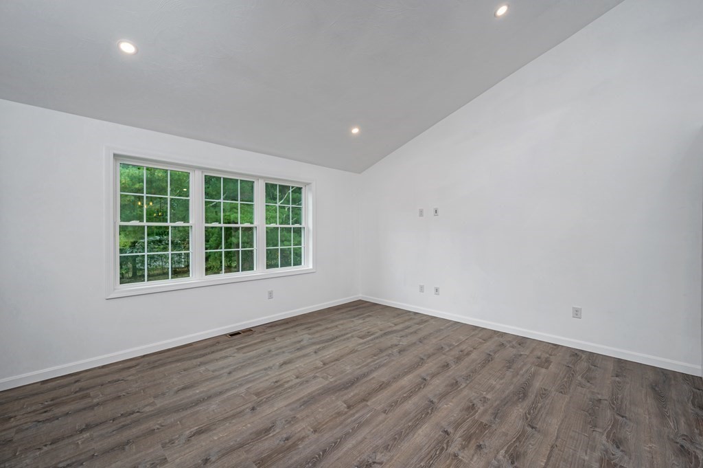 20 May Brook Road Holland, MA 01521 - Photo 4 of 28 an empty room with wooden floor and windows