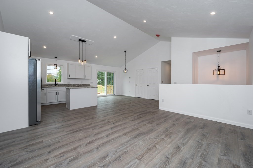 20 May Brook Road Holland, MA 01521 - Photo 6 of 28 a view of a kitchen with a refrigerator wooden floor and a sink