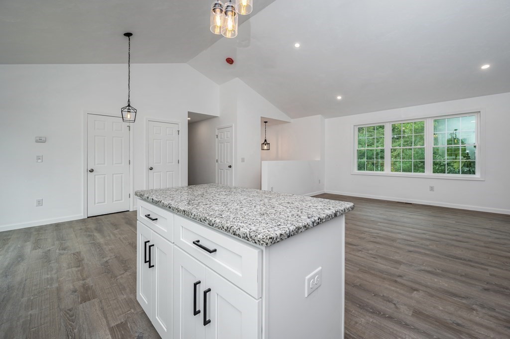20 May Brook Road Holland, MA 01521 - Photo 7 of 28 a kitchen with a stove and a wooden floor