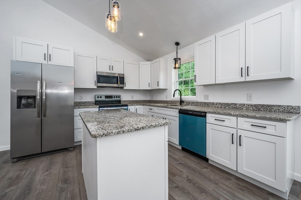 20 May Brook Road Holland, MA 01521 - Photo 10 of 28 a kitchen with granite countertop white cabinets and stainless steel appliances