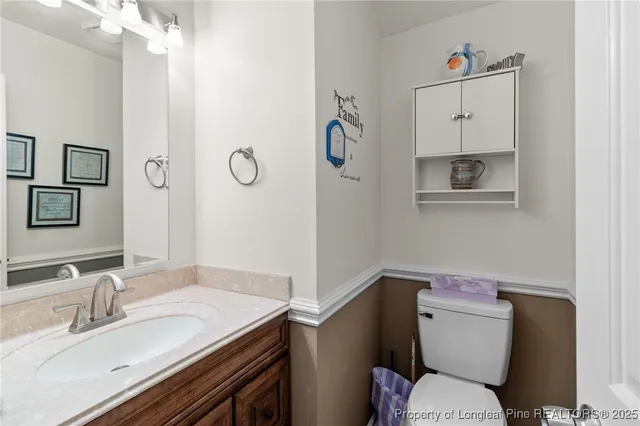 a bedroom with beds and a chandelier