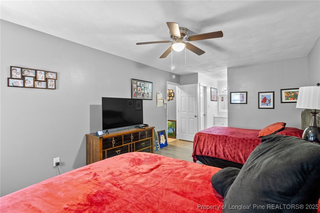 1912 Havilah Road Fayetteville, NC 28303 - Photo 15 of 21 a bedroom with a bed and a flat screen tv