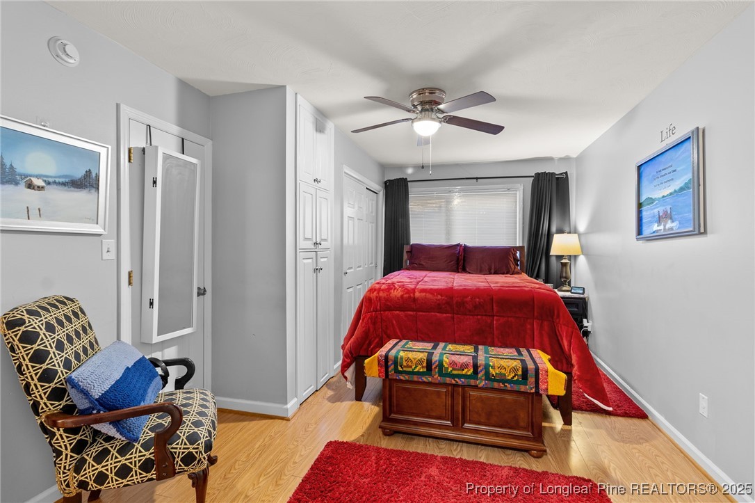 1912 Havilah Road Fayetteville, NC 28303 - Photo 18 of 21 a bedroom with a bed and wooden floor