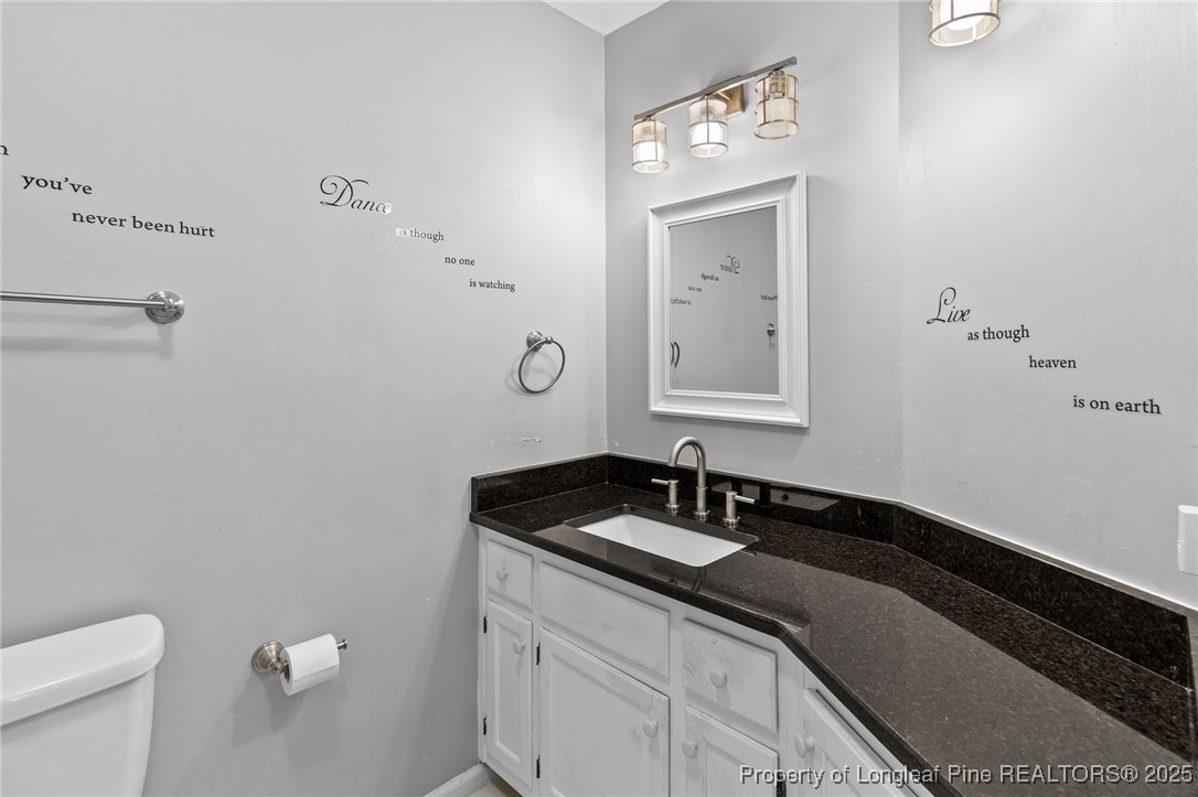 1912 Havilah Road Fayetteville, NC 28303 - Photo 19 of 21 a bathroom with a sink and a mirror