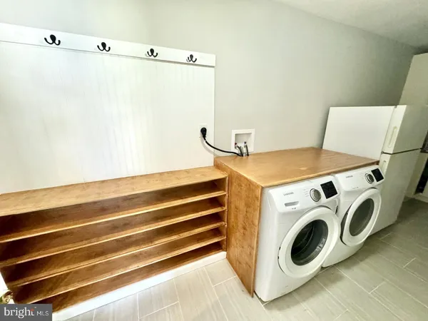 a utility room with dryer and washer