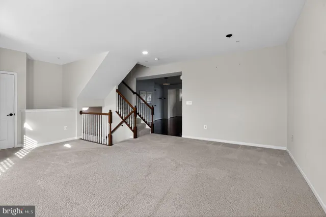 a view of an empty room with stairs