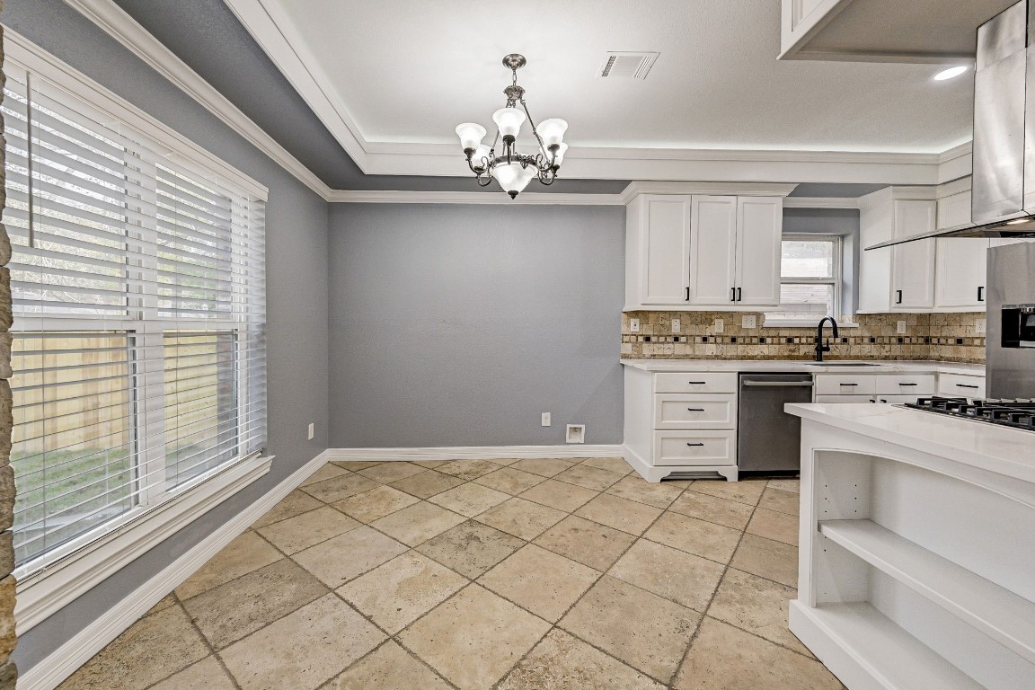 3306 Gary Lane Spring, TX 77380 - Photo 13 of 49 a kitchen with stainless steel appliances granite countertop a stove a sink and a microwave