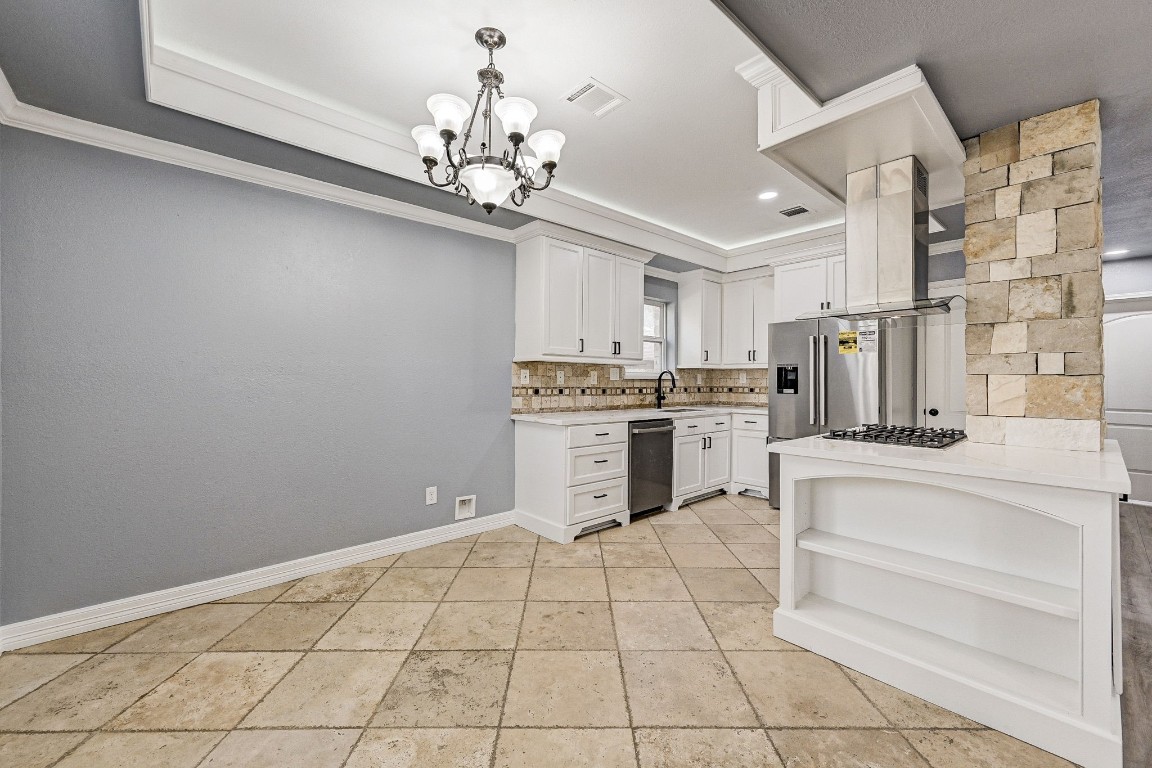 3306 Gary Lane Spring, TX 77380 - Photo 14 of 49 a kitchen with stainless steel appliances granite countertop a stove a sink and a refrigerator