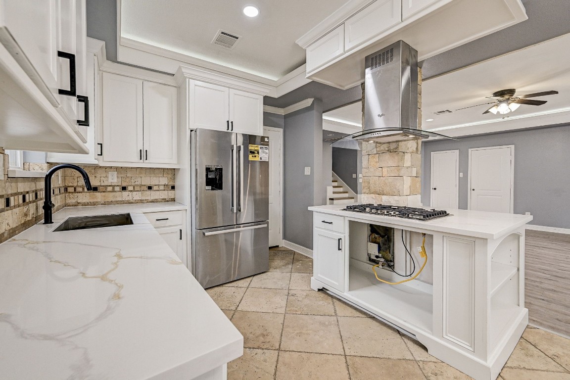 3306 Gary Lane Spring, TX 77380 - Photo 17 of 49 a kitchen with a stove sink and refrigerator
