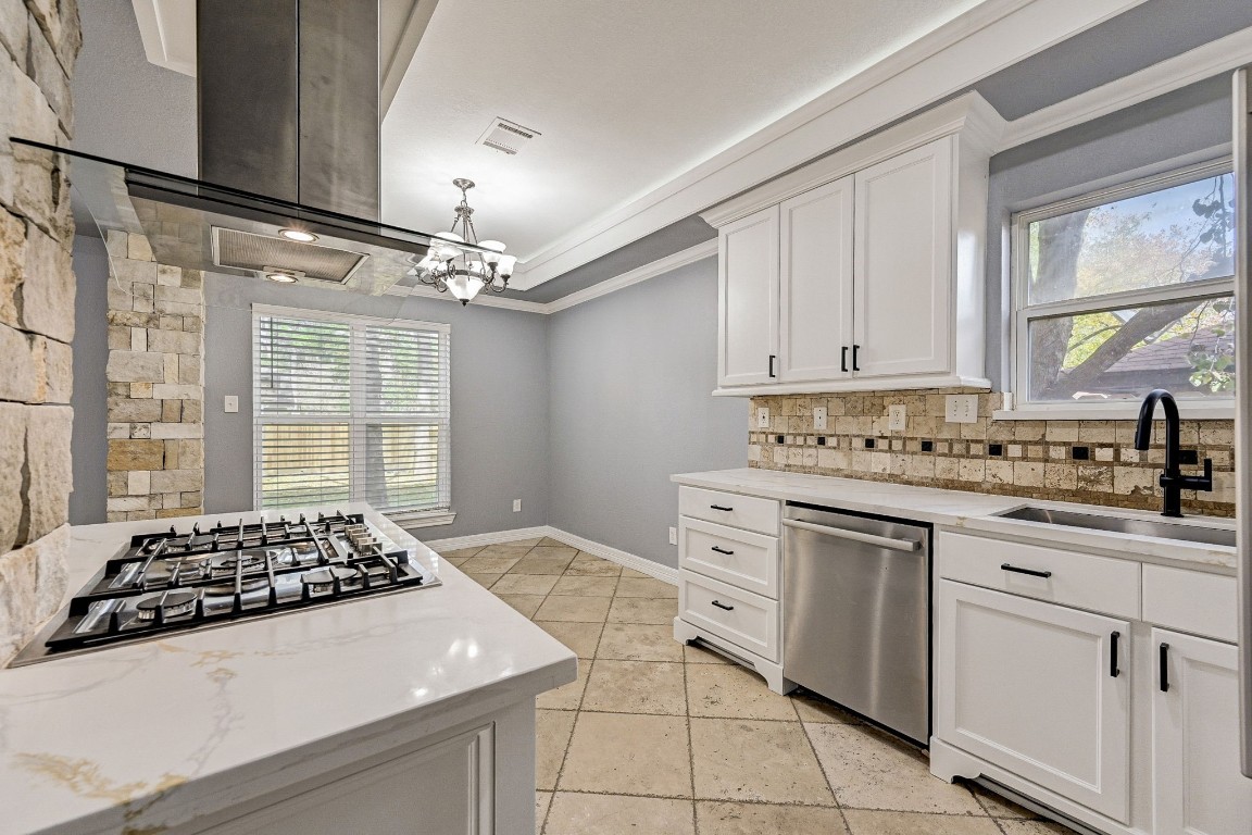 3306 Gary Lane Spring, TX 77380 - Photo 19 of 49 a kitchen with granite countertop a sink stove and cabinets