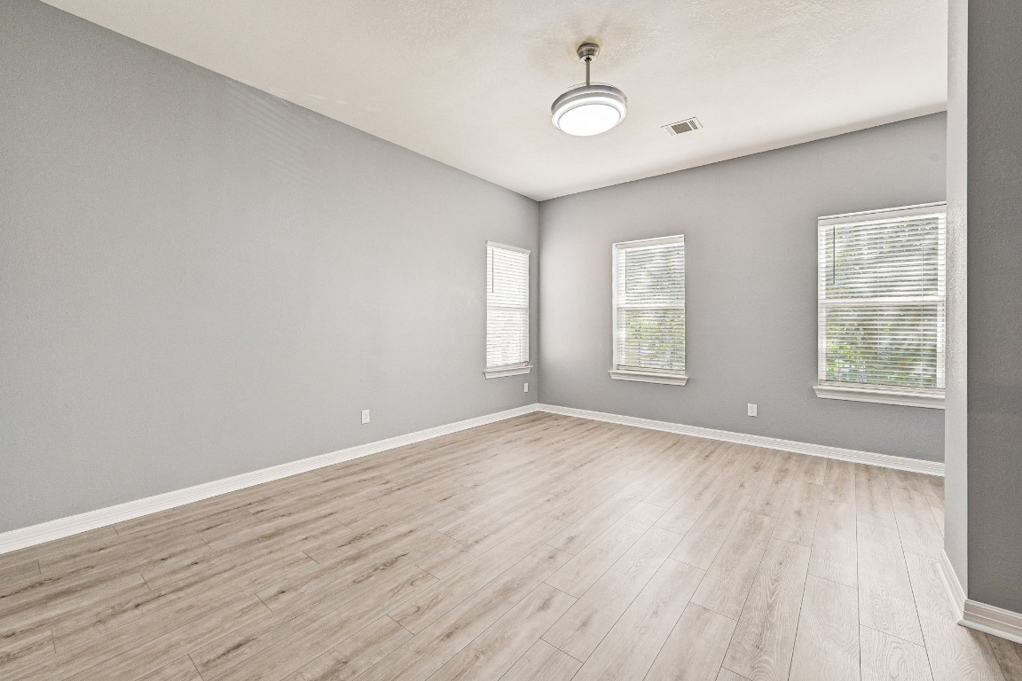 3306 Gary Lane Spring, TX 77380 - Photo 38 of 49 an empty room with wooden floor and windows
