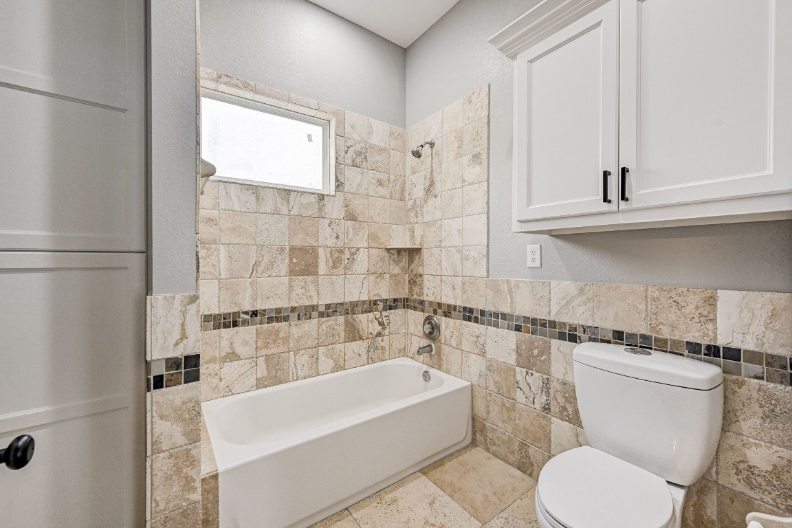 3306 Gary Lane Spring, TX 77380 - Photo 40 of 49 a bathroom with a sink a toilet and bathtub