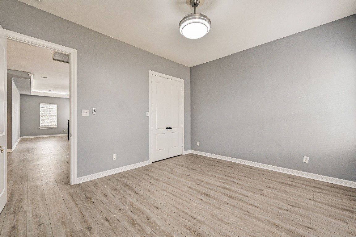 3306 Gary Lane Spring, TX 77380 - Photo 42 of 49 an empty room with wooden floor and windows