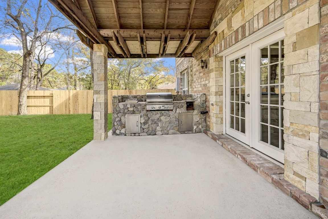 3306 Gary Lane Spring, TX 77380 - Photo 46 of 49 a view of a porch with couches chairs and potted plants