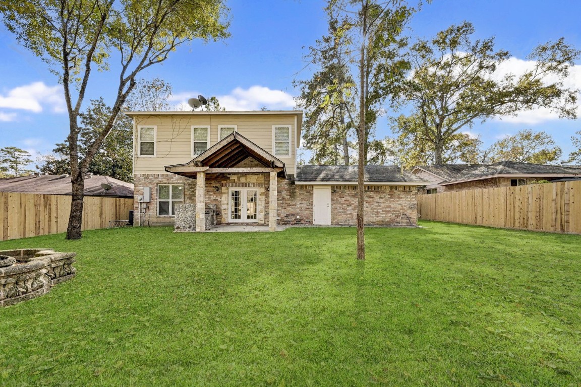 3306 Gary Lane Spring, TX 77380 - Photo 48 of 49 a view of a house with a yard and a large tree