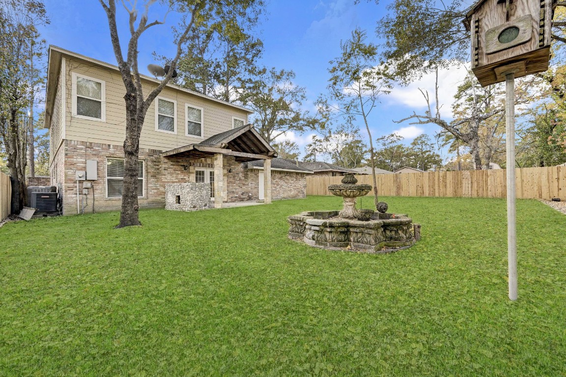 3306 Gary Lane Spring, TX 77380 - Photo 49 of 49 a view of a house with backyard and a tree