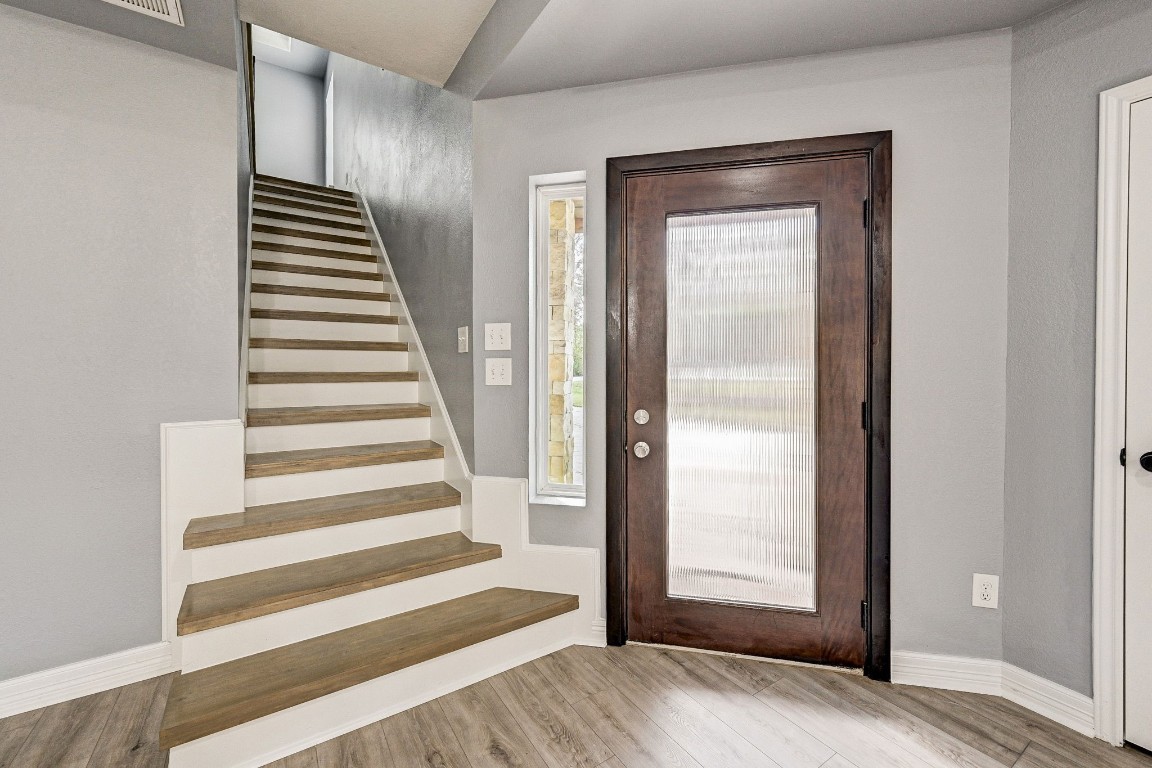 3306 Gary Lane Spring, TX 77380 - Photo 7 of 49 a view of a hallway with wooden floor and entryway