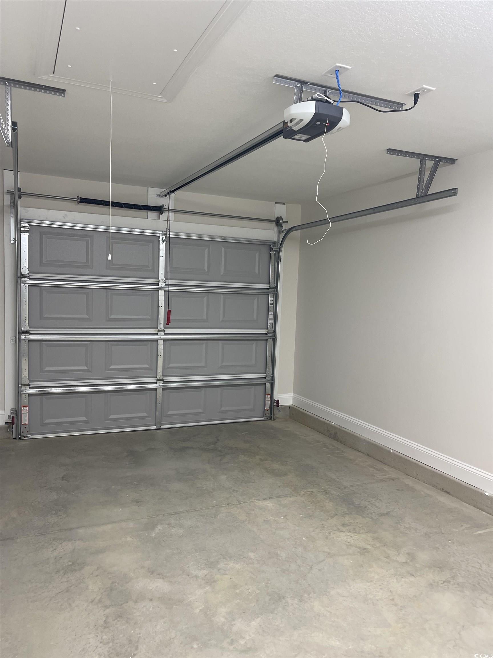 6922 Browns Way Shortcut Road Conway, SC 29527 - Photo 4 of 21 Garage featuring a garage door opener