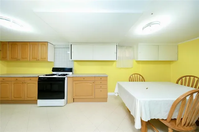 a kitchen with stainless steel appliances and white cabinets