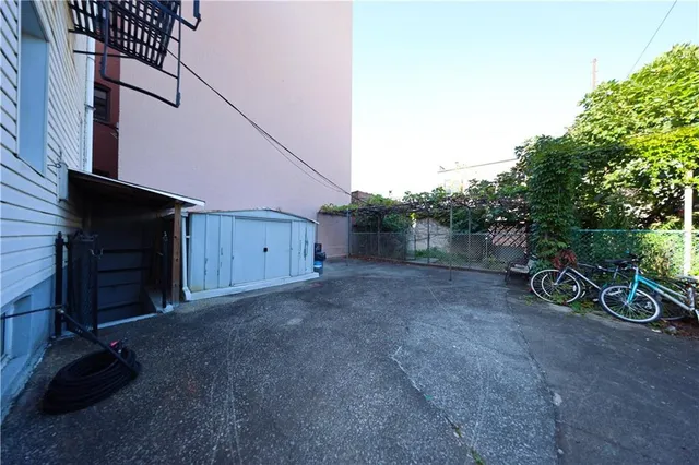 a view of backyard and garage