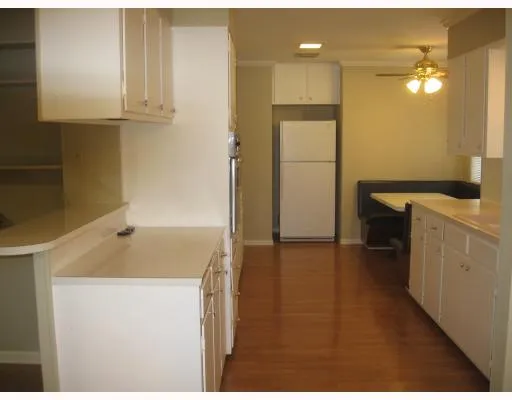 a kitchen with a sink and a refrigerator