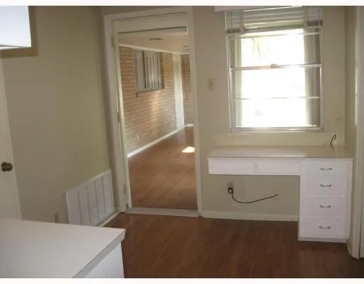a bathroom with a sink and a window