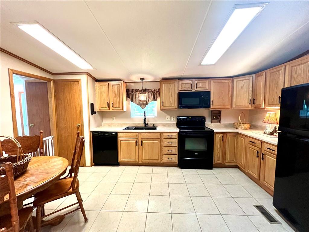 268 Harmony Drive Flinton, PA 16640 - Photo 11 of 19 a kitchen with a stove a sink and a microwave