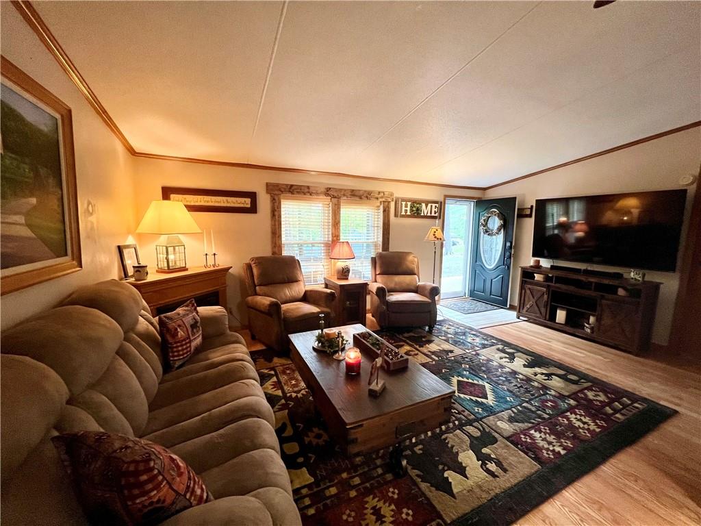 268 Harmony Drive Flinton, PA 16640 - Photo 12 of 19 a living room with furniture a rug and a flat screen tv