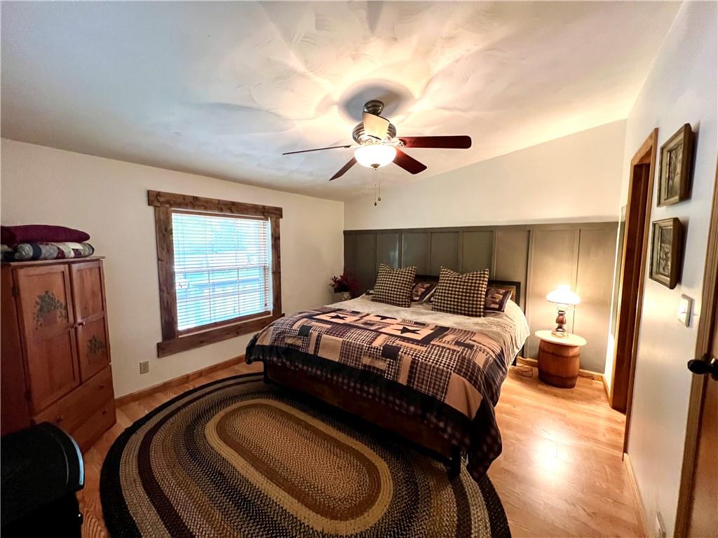 268 Harmony Drive Flinton, PA 16640 - Photo 14 of 19 a bedroom with a bed ceiling fan and a window