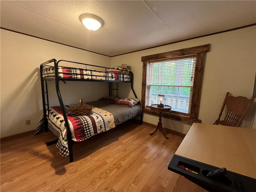 268 Harmony Drive Flinton, PA 16640 - Photo 16 of 19 a bedroom with bed and wooden floor