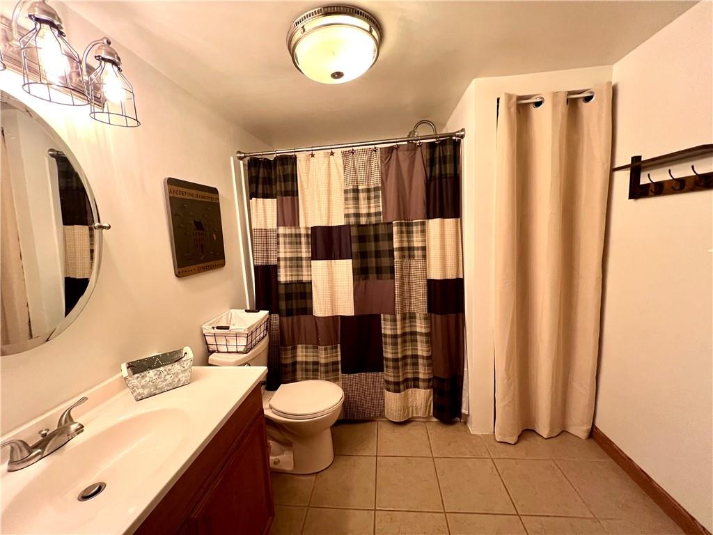 268 Harmony Drive Flinton, PA 16640 - Photo 18 of 19 a bathroom with a sink toilet and shower