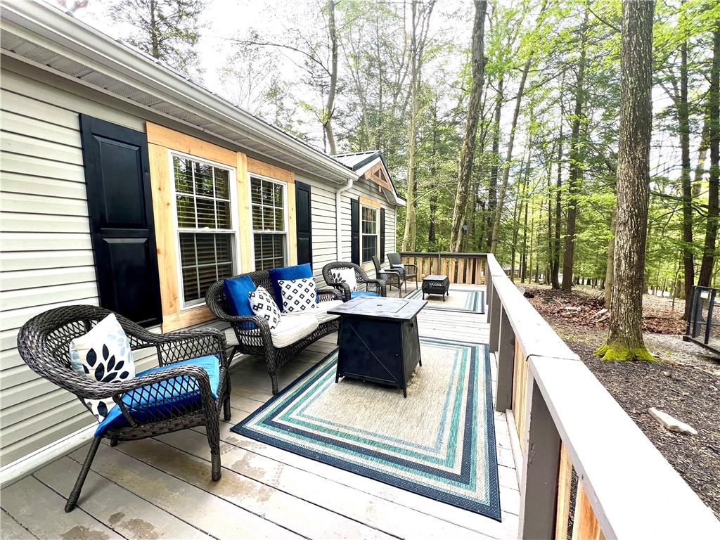 268 Harmony Drive Flinton, PA 16640 - Photo 4 of 19 a view of a patio with couches chairs and wooden floor