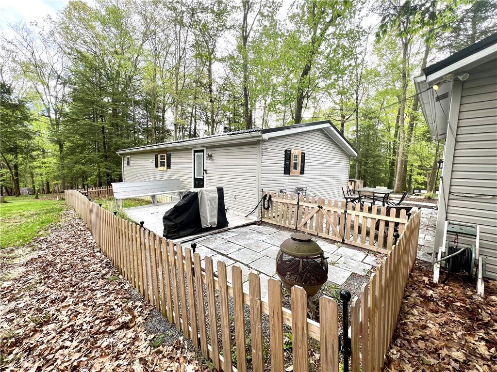 268 Harmony Drive Flinton, PA 16640 - Photo 7 of 19 a view of a patio with a table and chairs