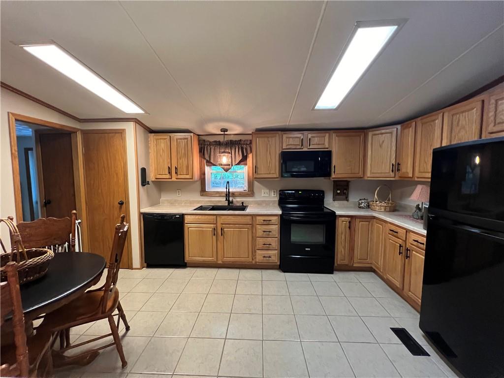 268 Harmony Drive Flinton, PA 16640 - Photo 9 of 19 a kitchen with a stove a sink dishwasher a refrigerator and a microwave