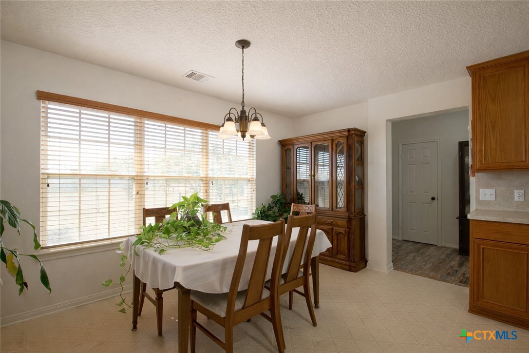 9439 Jeske Road Needville, TX 77461 - Photo 21 of 46 a view of a dining room with furniture window and outside view